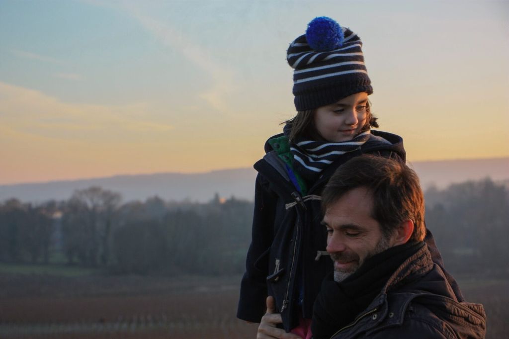 Father and son hugging sunset 1024x682