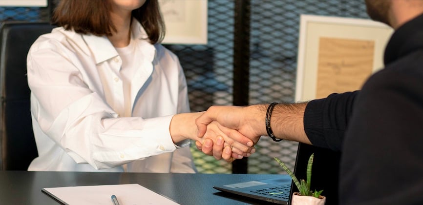 People shaking hands office